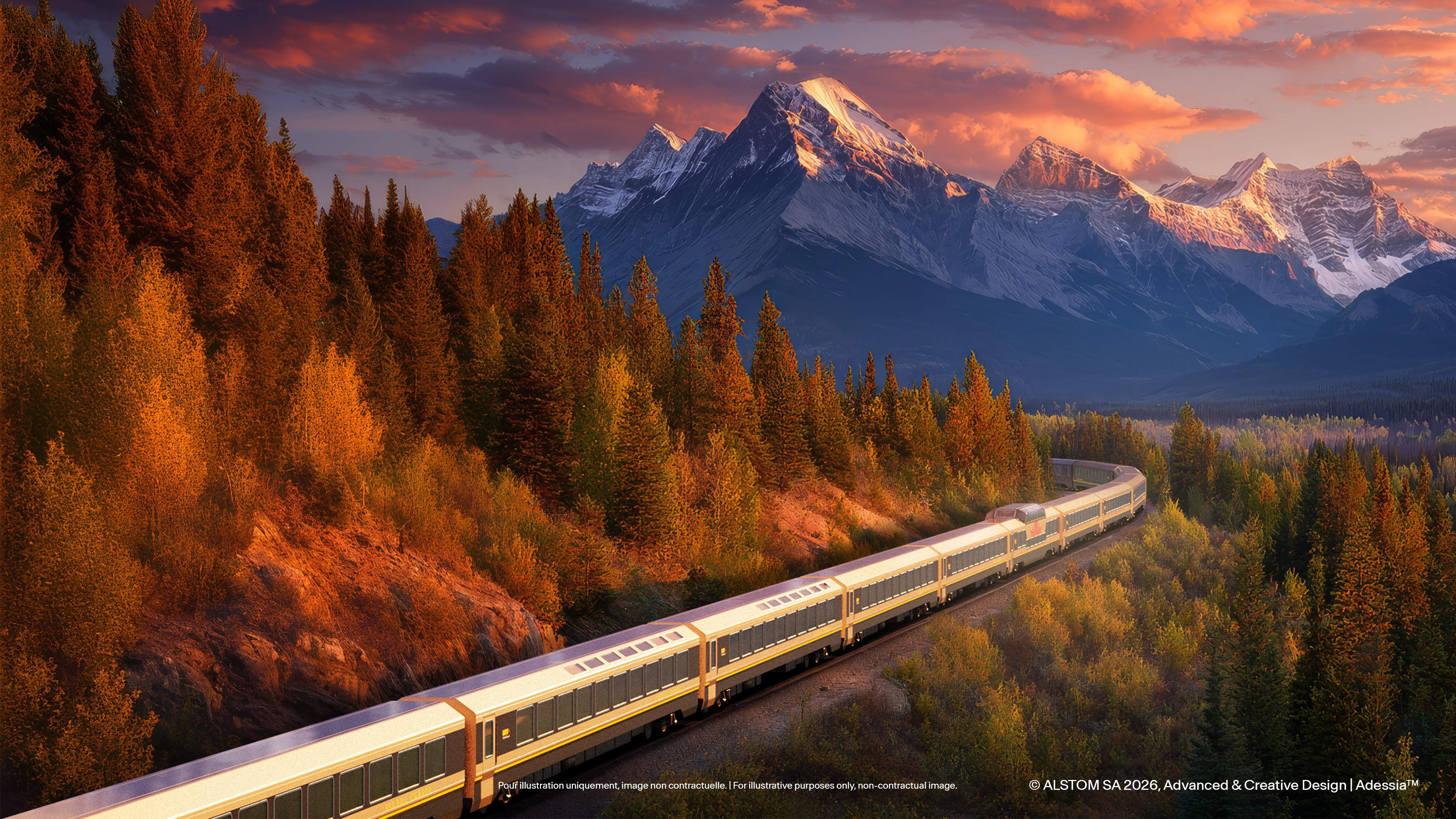 The train running through autumn forest with what looks like Mount Robson behind it